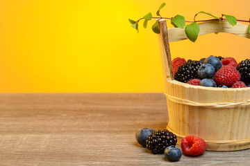 Wooden basket with berries