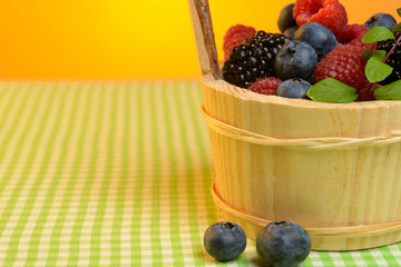 Wooden basket with berries