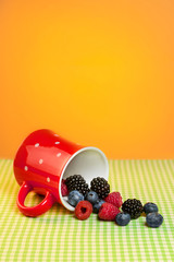 Cup with berries on the table