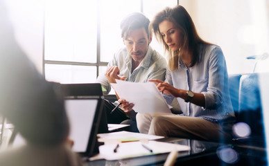 Teamwork concept.Young business people working with new startup project.Mobile devices on...