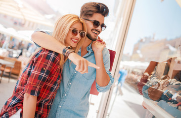 Shopping time. Young couple in shopping. Consumerism, love, dating, lifestyle concept