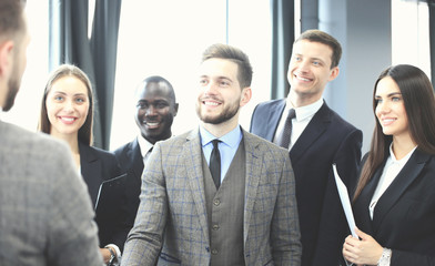 Business people shaking hands, finishing up a meeting.