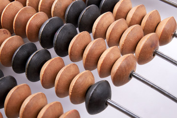 Old vintage retro abacus. Scratched accounting abacus, close up.