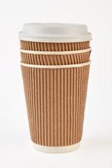 Paper cup take out coffee. Brown paper cup close up. Take coffe with you.