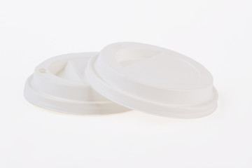 Plastic disposable coffee caps isolated. Two pure lids, white background.