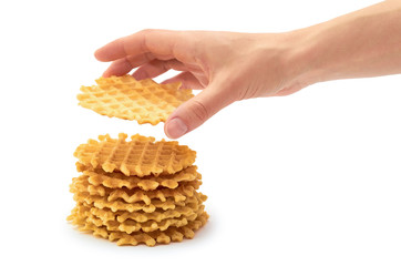 female hand holds homemade crisp Waffle. isolated on white background