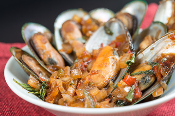 Mussel with white wine sauce on table