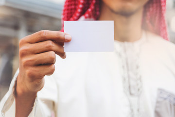Arab Businessman hand showing business card