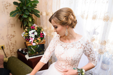 Beautiful young girl bride with fashion wedding hairstyle . Portrait of a young gorgeous bride in wedding white dress. Wedding.