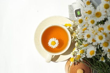 cup of herbal chamomile tea with camomile dry blossoms, dried camomile flowers. doctor treatment and prevention of immune concept, medicine - folk, alternative, complementary, traditional medicine