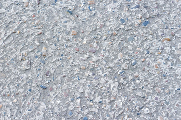 Texture concrete wall with stones. Closeup