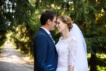 happy bride and groom at a park on their wedding day