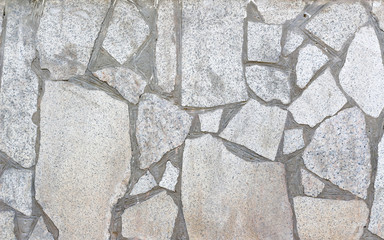 Texture concrete wall with stones. Closeup