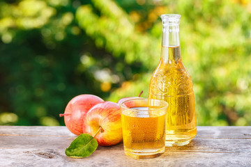 apple cider or juice on natural background