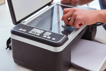 Repairman repairing broken color printer