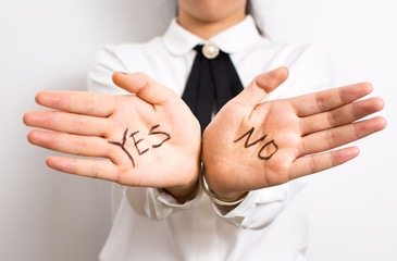 Yes or No? Words on businesswoman hands