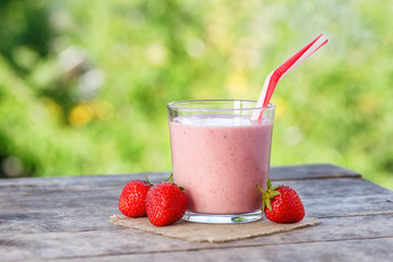 strawberry smoothie on natural background