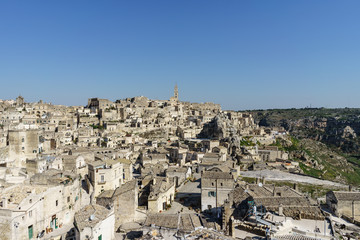 Obraz premium beauty of ancient ghost town of Matera (Sassi di Matera) in bright sun shine summer with blue sky, south Italy