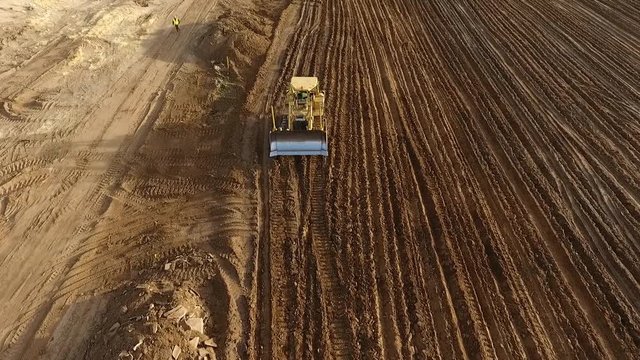 Aerial shot of a bulldozer at a construction site