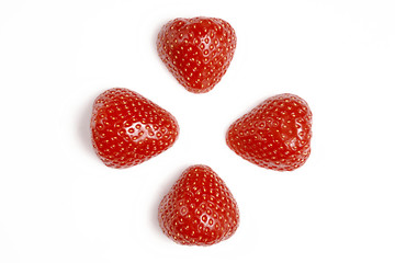 Two red fresh washed strawberries isolated on white background. Close up macro photo. Cut in half.