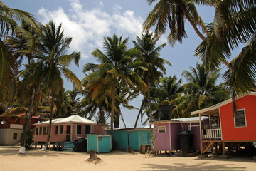 Cabins on stilts on the small island of Tobacco Caye, Belize, Central America
