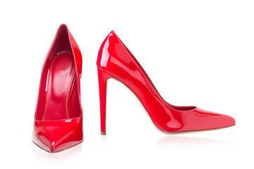 Women's red shoes from a varnish on a white background