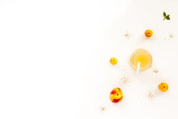 Fresh summer fruit. Peach, nectarine, apricot and mint on white background. Top view, flat lay, copy space