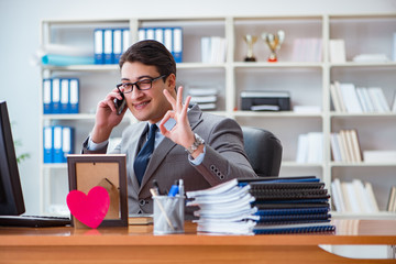 Businessman in saint valentine concept in office