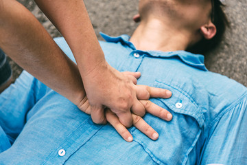 Emergency CPR on a Man who has Heart Attack , One Part of the Process Resuscitation (First Aid) - obrazy, fototapety, plakaty