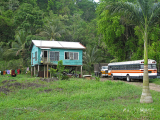 Traditional typical carribean house and old truck in Belize, Central America
