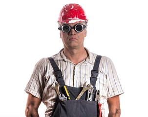 Studio portrait of a worker, a plumber, a fireman, a technician, an engineer, a mechanic, an electrician,builder