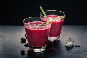 Berry smoothie on rustic background