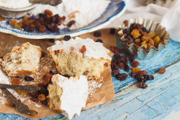 Home-made baking: Cupcakes with raisins and sugar powder