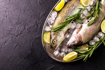 Seafood. Two raw rainbow trouts marinated with lime, rosemary