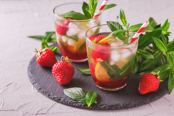Cold lemonade with fresh strawberry, mint, lime and jam