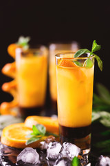 Aperitif with vodka, orange juice, chocolate and mint.