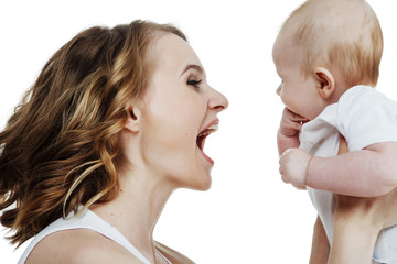 young beautiful mother with baby laughing isolated on white background