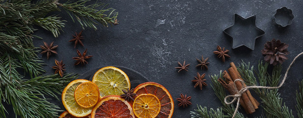 Caramelized citrus on a dark background, Mulled wine ingredients, Top view, Copy space, Bunner,...