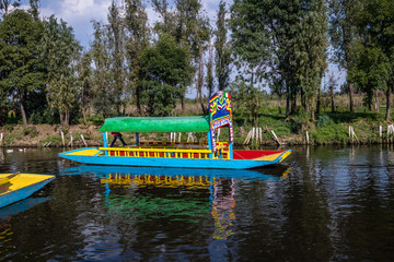 Colorful boat (also known as trajinera) at Xochimilco's Floating Gardens - Mexico City, Mexico © diegograndi