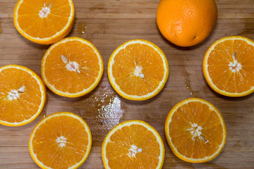 Sliced orange on a wooden board