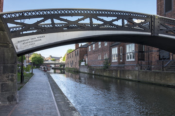 Old iron bridge spanning the industrial canal's of the city of Birmingham, England