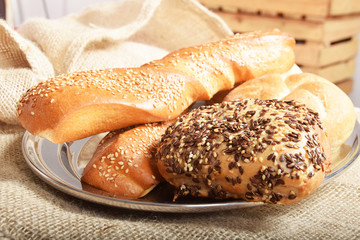 Baked fresh bread rolls for breakfast with grains