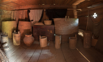 Dark old wooden barn with utensil. Ukraine