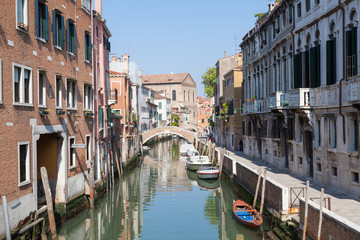 Fototapeta na wymiar Venice,Veneto, Italy. View along Rio Santa Catarina canal in Cannaregio towards Scuola Grande Misericordia 