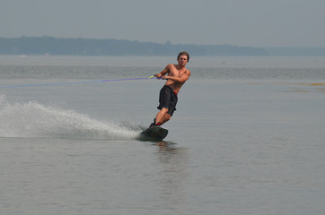 Young Man Riding a Wakeboard in Maine's Casco Bay