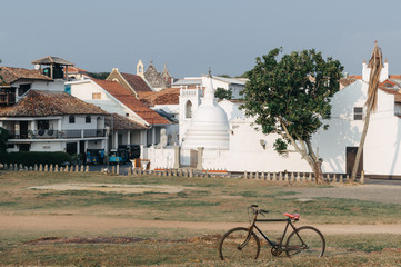 Beautiful scenery of ancient Dutch Galle Fort (UNESCO World Heritage Site) with Christian church and Buddhist stupa - view from fortification wall, southwest coast of Sri Lanka island, South Asia