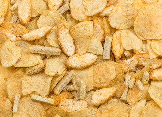 Salty snacks as food background.