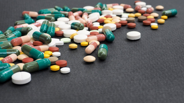 Drug and medicines on black paper