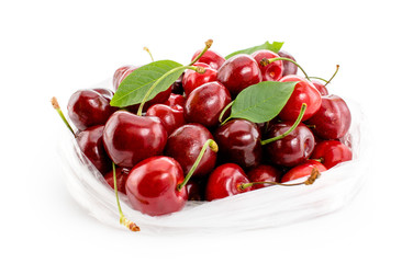 Cherries in package on white background