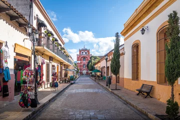 Fotobehang Voetgangersstraat en Del Carmen Arch Tower (Arco Torre del Carmen) - San Cristobal de las Casas, Chiapas, Mexico © diegograndi